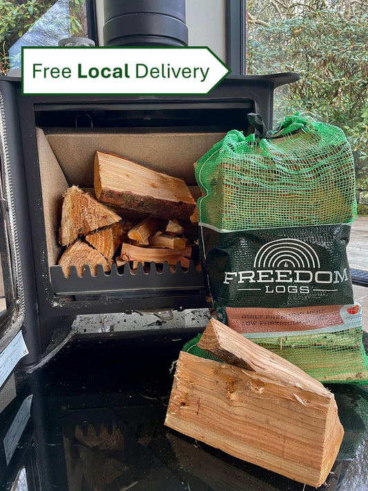 Wood stove with wood logs and a bag of Freedom Logs, with 'Free Local Delivery' text.